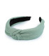 Elegantes Haarband mit einfarbigem Stoff und Streifenstruktur mit Knoten